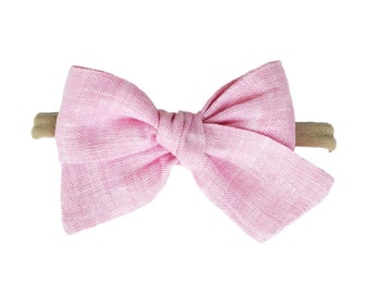 Pink linen bows on a nylon headband, for newborns and little girls, cute pink baby hair bow