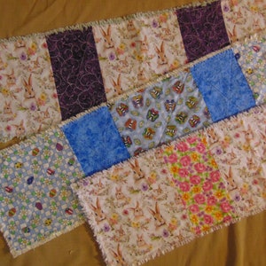 May include: A set of three ceramic mugs with a speckled, matte finish. The mugs are in shades of cream, light brown, and dark brown. Each mug has a simple, minimalist design, perfect for coffee or tea.