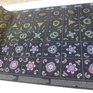 May include: A black and white poster with a grid of colorful geometric patterns. The patterns are made up of circles, lines, and dots. The poster is titled "Flower Power" and includes instructions on how to create the patterns.