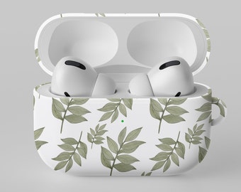 May include: A white wireless earbud charging case with an open lid, featuring a repeating pattern of sage green leaves. Inside the case are two white wireless earbuds with black accents. A small green LED indicator light is visible on the front.