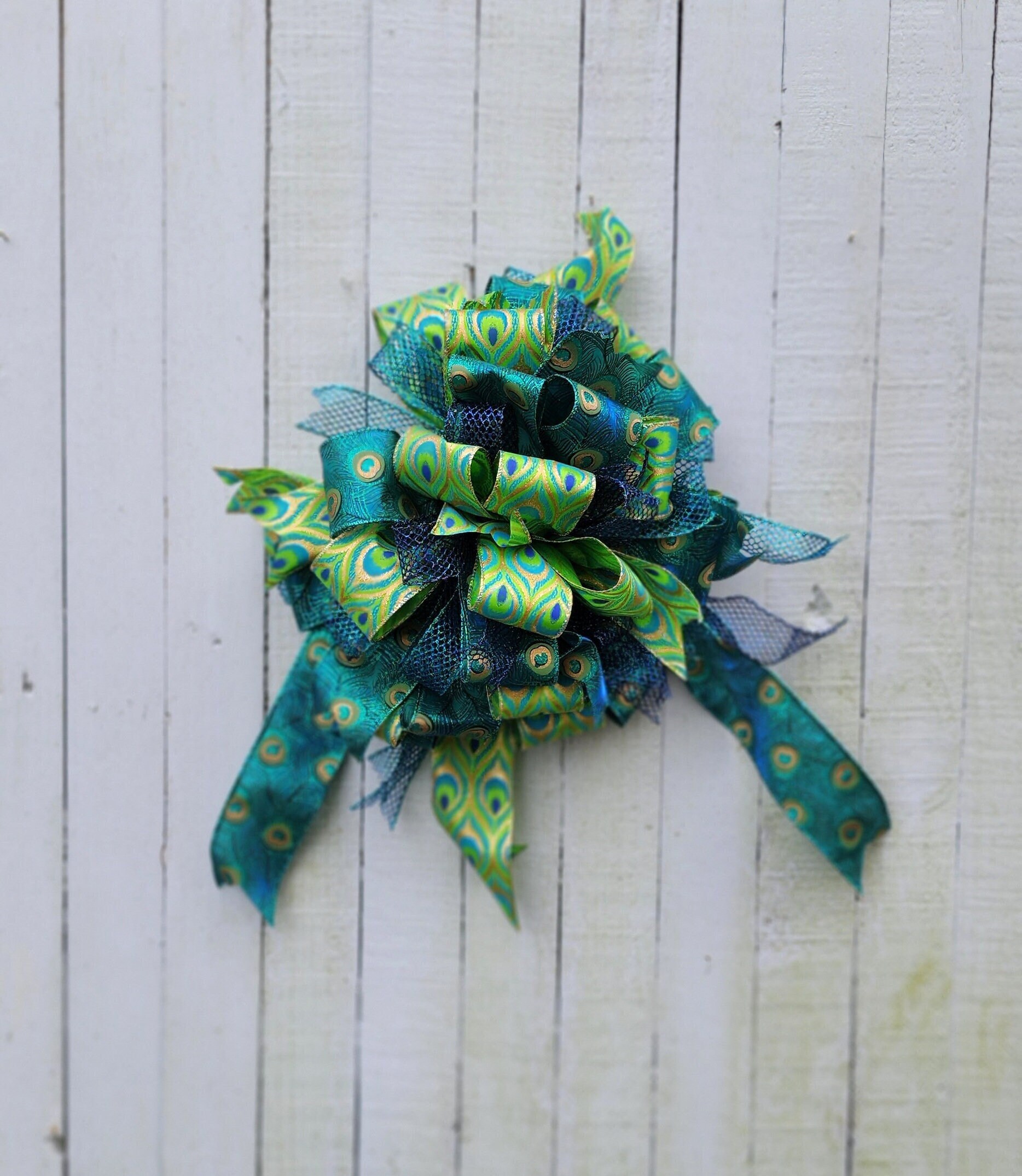 37 Unique Christmas Tree Themes to Inspire Your Holiday Spirit: Deck the Halls Like Never Before! 19 Peacock Christmas Tree Topper Bow: Teal, Blue, and Green Wired…