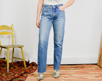 Boyfriend jeans W32 L31 vintage 90's pantalon en denim bleu zip mouche taille haute coupé jambe droite jambe L/XL