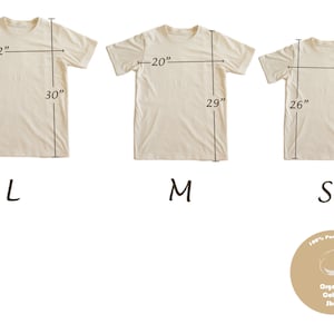 May include: Three cream-colored t-shirts, labeled L, M, and S, with measurements in inches. The L shirt is 22" wide and 30" long. The M shirt is 20" wide and 29" long. The S shirt is 19" wide and 26" long. A circular logo reads "100% Pure Cotton" and "Organic Cotton Shop."