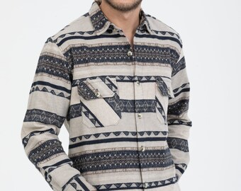 May include: A long-sleeved button-down shirt with a beige and navy blue geometric pattern. The shirt has a relaxed fit and a classic collar.