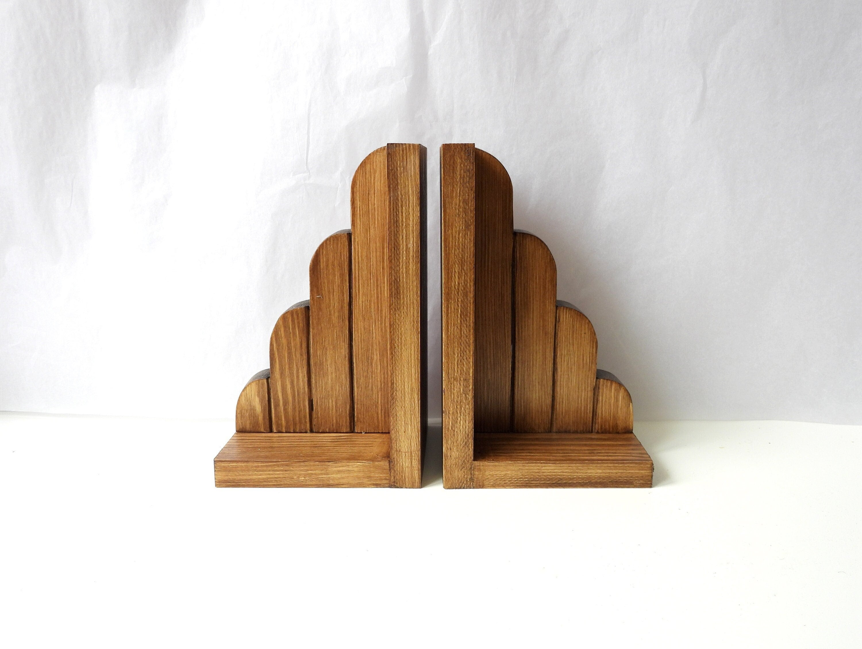 A pair of substantial oak country house book ends, each boldly carved