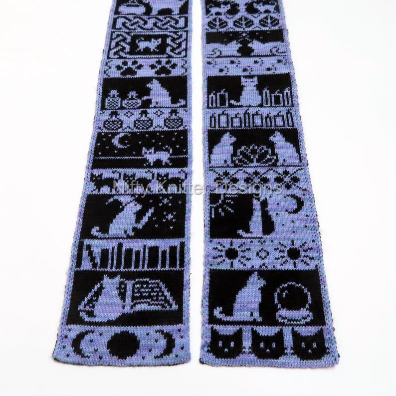 May include: A knitted scarf with a repeating pattern of black cat silhouettes and other designs on a light purple background. The scarf features various cat poses, moons, and other decorative elements.
