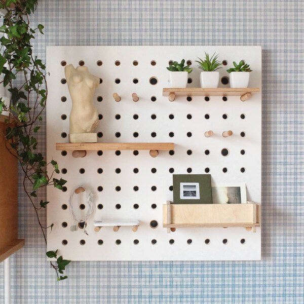 Pegboard display, pegboard organizer, plywood peg board shelves, wall decor, office pegboard.