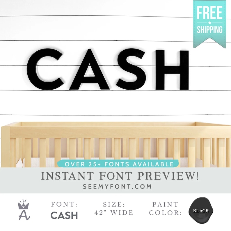 May include: Black wooden letters spelling "CASH" in a modern font, mounted on a white wood panel wall. The letters are 42 inches wide.  The text "OVER 25+ FONTS AVAILABLE INSTANT FONT PREVIEW! SEEMYFONT.COM" is below the letters. A crown icon is to the left of the word "FONT".