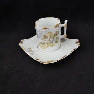KPM Berlin porcelain mocha cup with small gold decoration, small defect