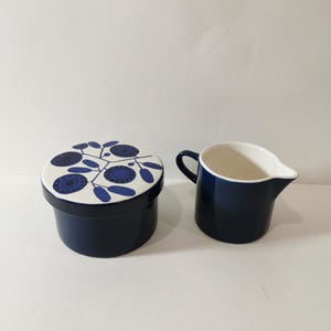 Enchanting Melitta Stockholm tin sugar bowl and milk jug lidded tin Liselotte Kantner cobalt blossom midcentury ceramic flower decor 60s