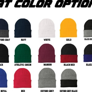 May include: A selection of 12 different colored knit beanies. The beanies are arranged in three rows of four. The colors include navy, white, gold, black, athletic green, maroon, black/red, black/royal, athletic royal, red, oxford grey, and oxford grey/black.