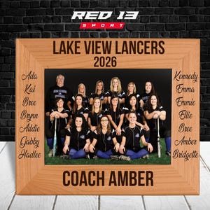 May include: A wooden picture frame with a team photo of the Lake View Lancers 2026. The frame has the team name and year engraved at the top. The names of the team members and "Coach Amber" are also engraved on the frame.