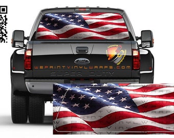 May include: A black pickup truck with a US flag decal on the rear window. The decal features a waving American flag with red, white, and blue stripes and white stars on a blue field. The truck has the words "SUPER DUTY" printed on the tailgate.
