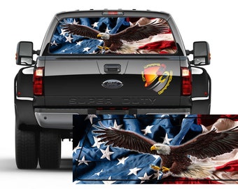 May include: Rear window graphic featuring a bald eagle with outstretched wings against a backdrop of the American flag. The design is displayed on the back of a black Super Duty truck.