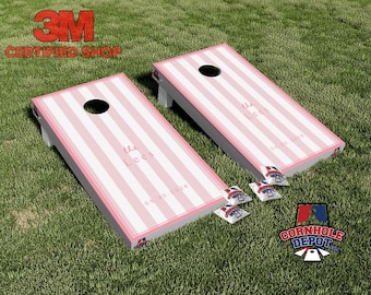 Conjunto de adesivos laminados personalizados com nome e listras rosa para jogo de arremesso de sacos de milho (Cornhole), ideais para presentes de aniversário e casamento.