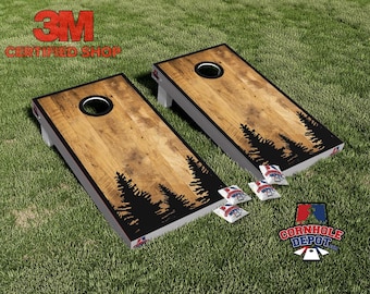 Juego de láminas laminadas para tablero de cornhole con diseño de pinos del bosque.