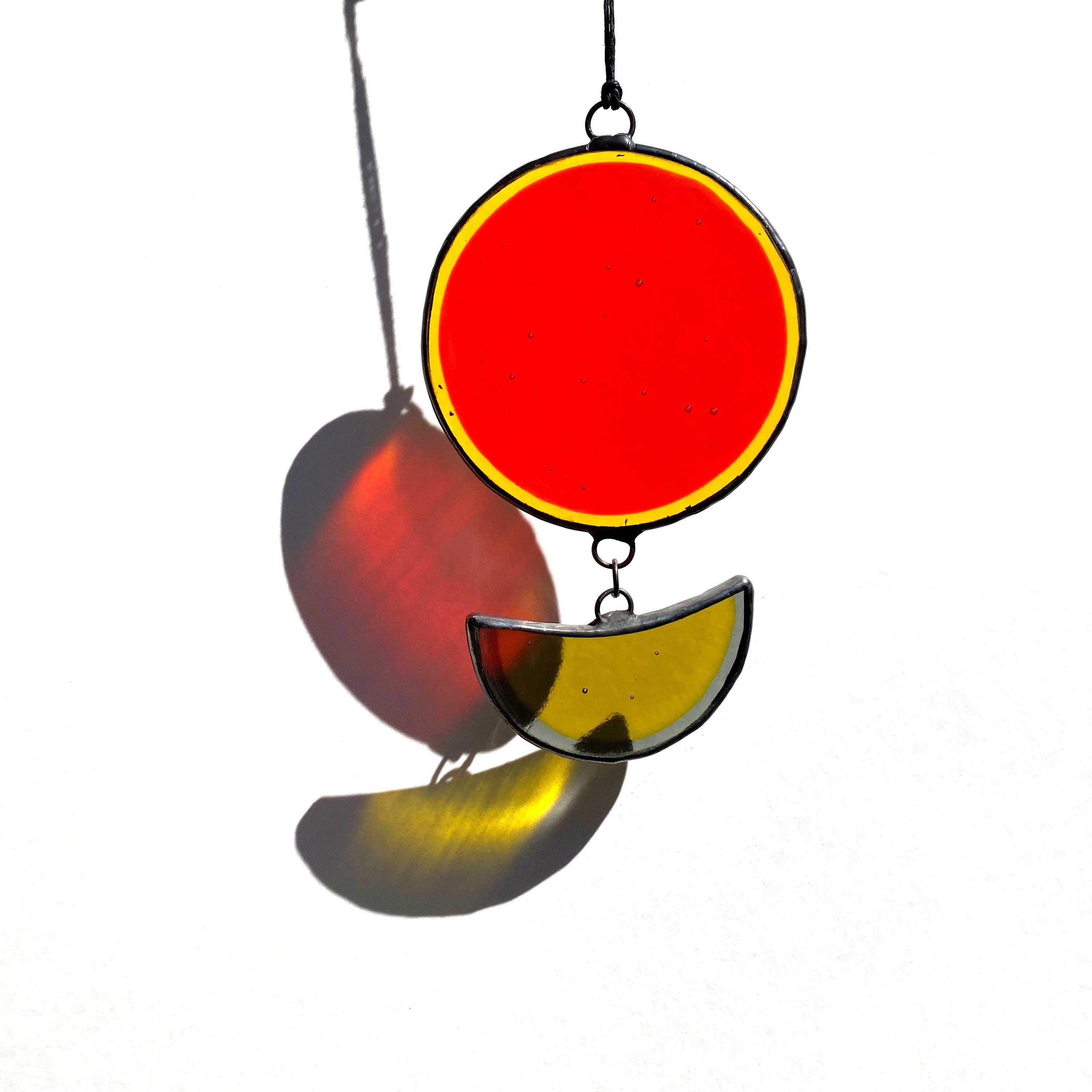 Orange stained glass suncatcher, Unique colorful round fused glass window art, Pendant-style glass window hanging, Brightly colored glass