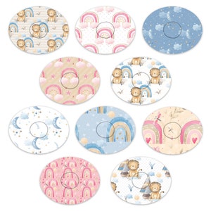 Peut inclure: Ensemble de 10 designs circulaires imprimables pour une fête prénatale ou une décoration de chambre d'enfant. Les motifs présentent des arcs-en-ciel, des nuages, des étoiles, des lions et une libellule. Les couleurs sont le rose, le bleu, le beige et le blanc.
