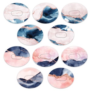 May include: Set of ten round stickers with a watercolour design featuring abstract shapes in shades of pink, blue, and gold. The stickers have a glossy finish and are perfect for adding a touch of elegance to your crafts, planners, or laptops.