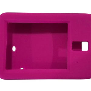 May include: A bright pink silicone case for a tablet or e-reader. The case has a cutout for the camera and a raised lip around the screen to protect it from scratches.