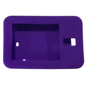 May include: A purple silicone case for a small electronic device. The case has a cutout for the device's camera and a small hole on the side.
