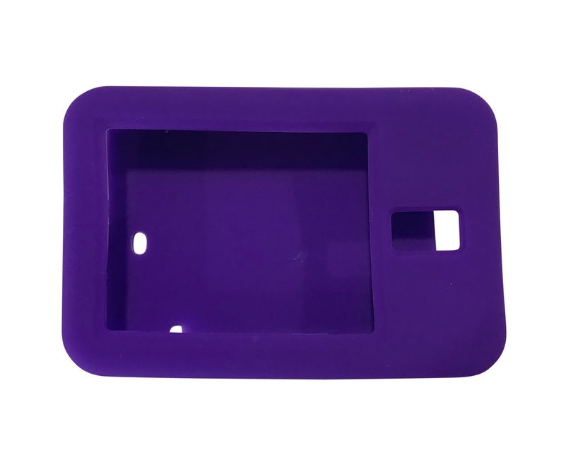 May include: A purple silicone case for a small electronic device. The case has a cutout for the device's camera and a small hole on the side.