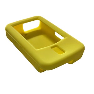 May include: A yellow silicone case for a small electronic device. The case has a cutout for a screen and buttons.