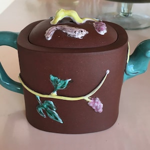 Yixing teapot with enameled decoration with grapes and squirrels