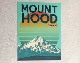 May include: A retro-style poster featuring Mount Hood, a snow-capped mountain in Oregon, with a sunset behind it. The text "Mount Hood Oregon" is in bold, black letters.