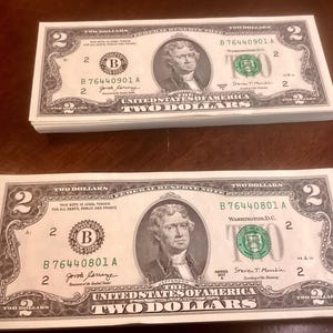 2 bundles of two dollar bills, sequential order 801A-1000, uncirculated, (please look at pictures)