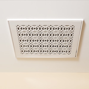 May include: White ceiling vent with a decorative, geometric pattern.