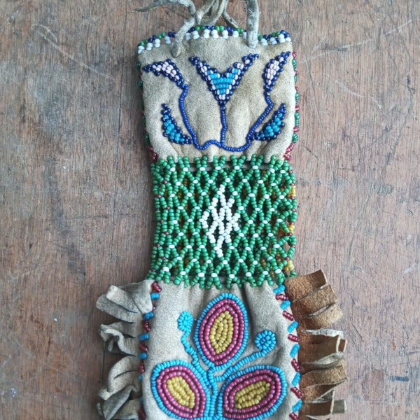 Northern Plains beaded pipe bag...each side different 9" w strap open bead work