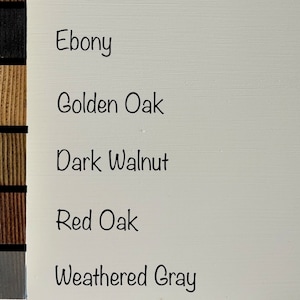 May include: Wood stain color samples in five different shades: Ebony, Golden Oak, Dark Walnut, Red Oak, and Weathered Gray.