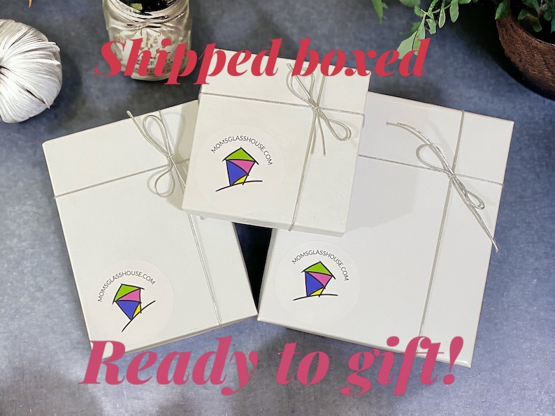 May include: Three white gift boxes with a silver ribbon tied around each box. Each box has a colorful logo sticker with the text "MOMSGlassHOUSE.COM" and a stylized image of a house. The text "Shipped boxed" is written in red at the top of the image and the text "Ready to gift!" is written in red at the bottom of the image.
