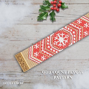 May include: A red, white, and gold beaded bracelet with a geometric pattern. The bracelet has a gold clasp with an ornate design. The text "Odd Count Peyote Pattern" is visible. Holly and berries are in the background.