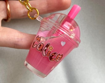 Calico Game melkthee-sleutelhanger
