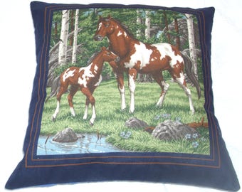 Lovely brown and white Mare and foal by a stream cushion pillow