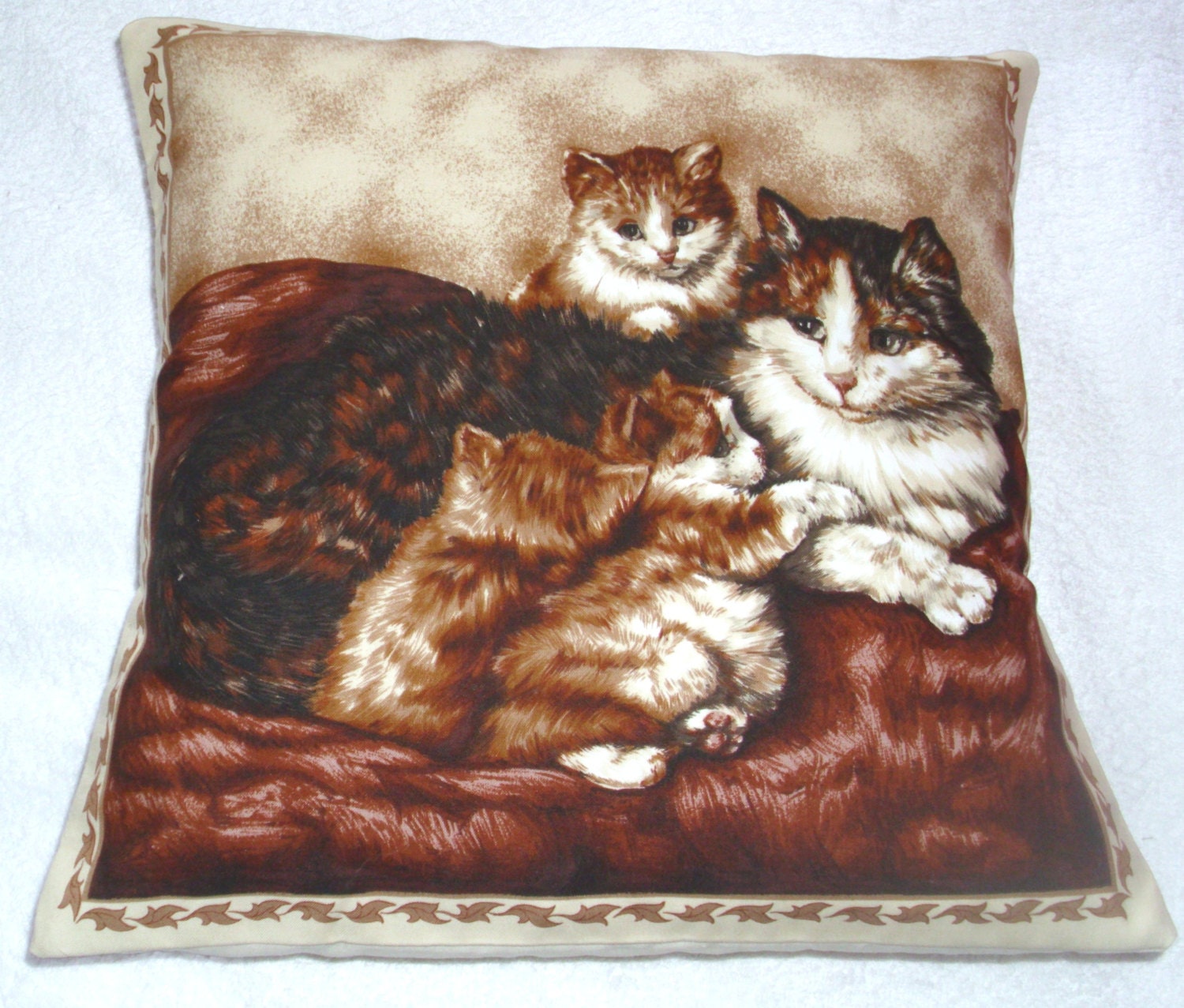 A lovely brown and White cat and her three very pretty kittens cushion pillow