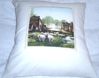 cushionOn the Farm cushion with sheep in a field by farm buildings pillow