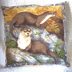 Two Otters on the rocks cushion
