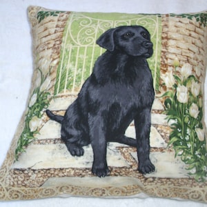 A lovely Black Labrador waiting by the garden gate cushion pillow