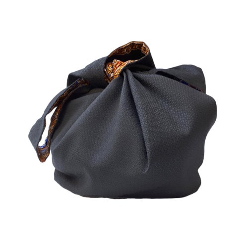 Elegante sacco borsa, tessuto nero e fantasia dashiki.