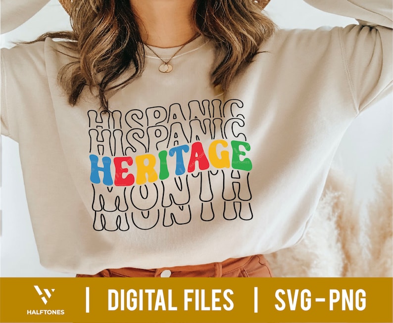 May include: A white sweatshirt with the text "HISPANIC HERITAGE MONTH" in colorful, wavy letters.