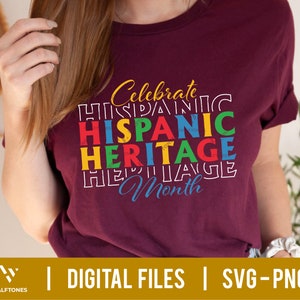May include: A maroon t-shirt with the text "Celebrate Hispanic Heritage Month" in colorful block letters.