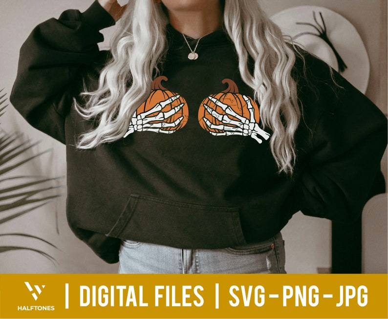 May include: A black hoodie with a skeleton hand holding a pumpkin on each side of the chest. The hoodie has a drawstring hood and a kangaroo pocket.