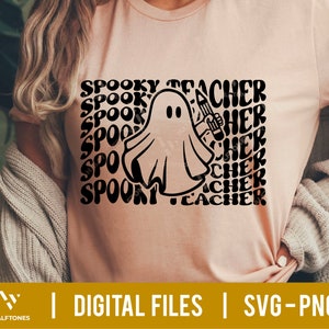 May include: A pink t-shirt with a black and white graphic of a ghost holding a pencil. The text "Spooky Teacher" is repeated in a wavy font around the ghost.