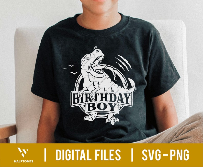 May include: A black t-shirt with a white graphic of a dinosaur roaring with the text "Birthday Boy" in a circle.