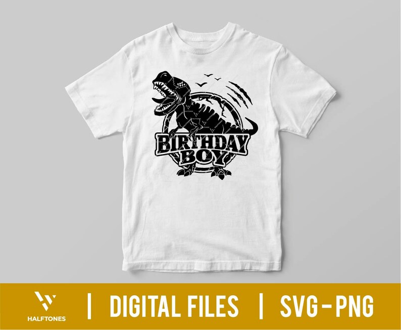 May include: A white t-shirt with a black graphic of a dinosaur with the text "Birthday Boy" in a circle.