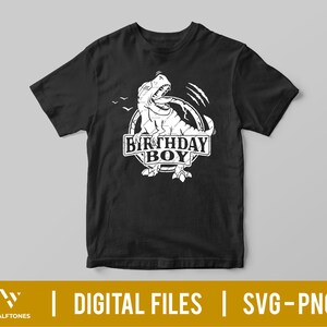 May include: Black t-shirt with a white graphic of a dinosaur roaring with the text "Birthday Boy" in a circle.