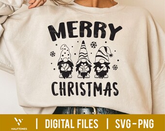 May include: A white sweatshirt with the text "Merry Christmas" and a graphic of three gnomes holding gifts. The gnomes are wearing red hats and have white beards.